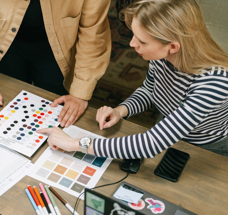 A collaborative team workspace focusing on planning using color charts and documents.